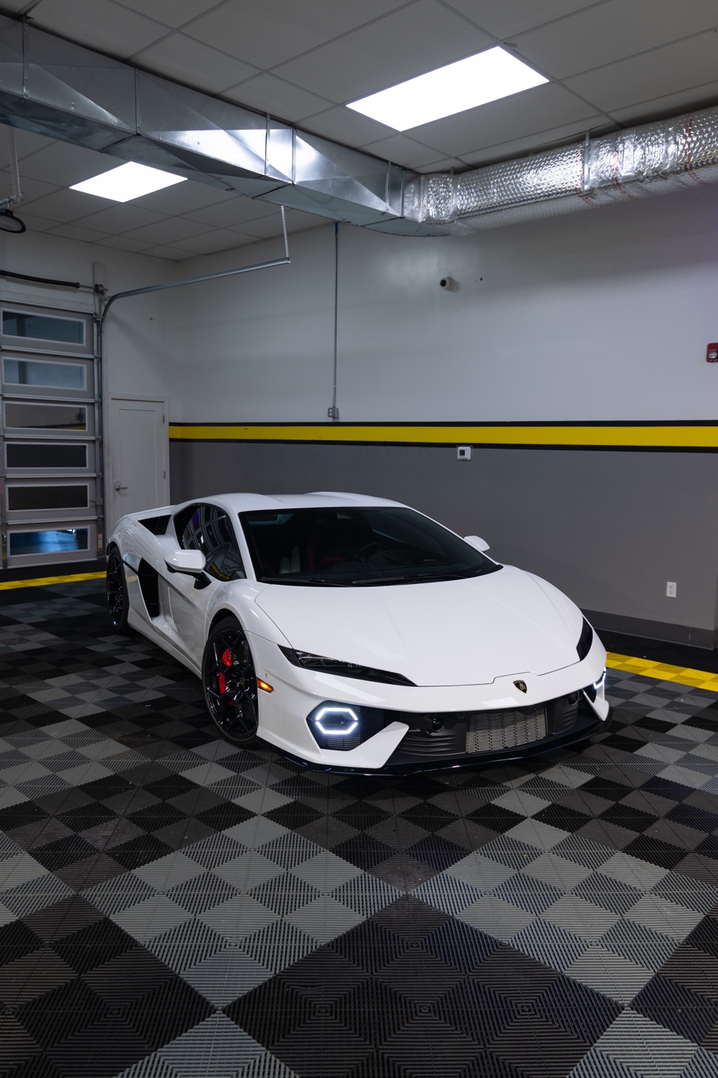 White Lamborghini Temerario front three-quarter view showing protected painted surfaces