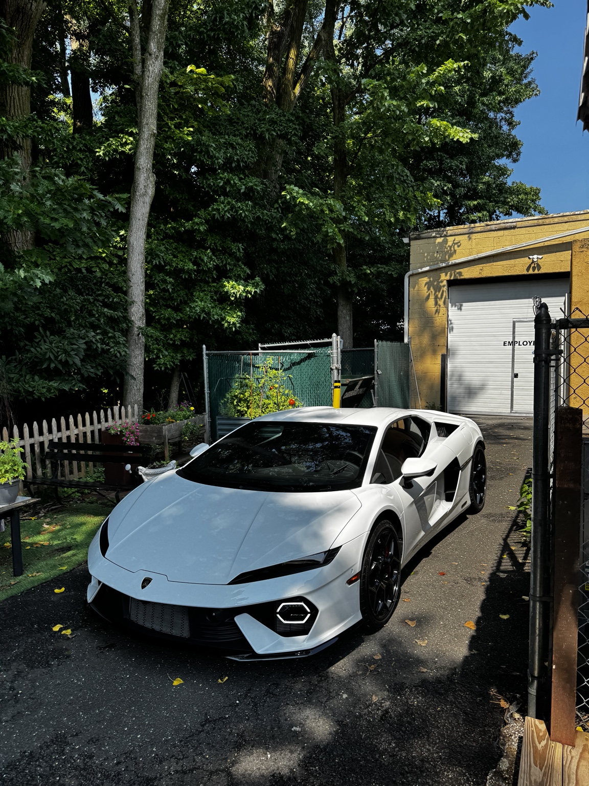 White Lamborghini Temerario outdoors with its windshield visible after protection film